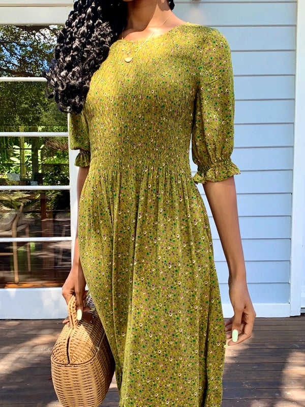 Moss Green vintage inspired dress with vintage florals, features short sleeves and knee length, smock elastic at bust to waist line
