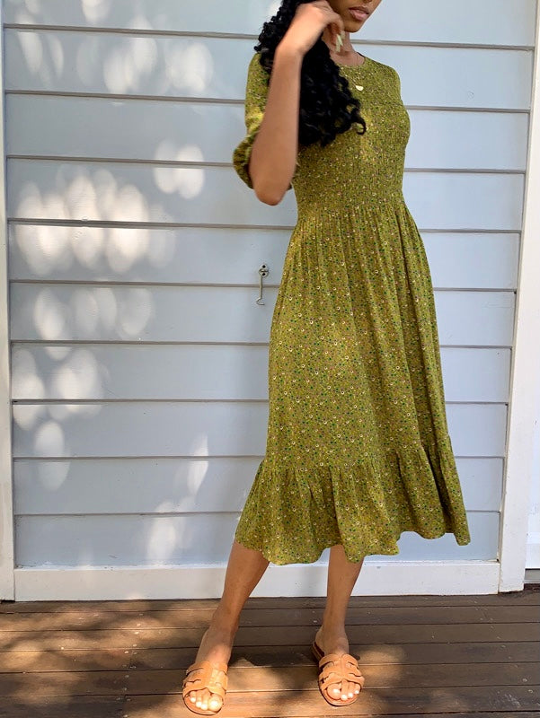 Moss Green vintage inspired dress with vintage florals, features short sleeves and knee length, smock elastic at bust to waist line
