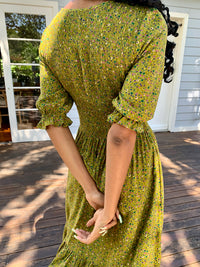 Moss Green vintage inspired dress with vintage florals, features short sleeves and knee length, smock elastic at bust to waist line
